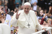 Pope Francis waves to the waiting crowds on College Green, Dublin, as he travels in the Popemobile during his visit to Ireland on Aug. 25, 2018. (Joe Giddens/PA via AP)