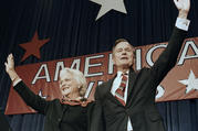In this Nov. 8, 1988 file photo, President-elect George H.W. Bush and his wife Barbara wave to supporters in Houston, Texas after winning the presidential election. (AP Photo/Scott Applewhite, File)​​​​​​​