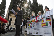 Child psychologist and founding member of the Ending Clergy Abuse (ECA) organization, Miguel Hurtado from Spain, center, reads an open letter to the Benedictine order outside the St. Anselm on the Aventine Benedictine complex in Rome on Feb. 22. (AP Photo/Domenico Stinellis)