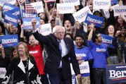 Democratic presidential candidate Sen. Bernie Sanders, with his wife Jane O'Meara Sanders, arrives to at a primary night election rally in Manchester, N.H., on Feb. 11. (AP Photo/Pablo Martinez Monsivais)