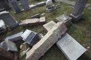 In this Monday, Feb. 27, 2017 file photo,toppled and damaged headstones rest on the ground at Mount Carmel Cemetery in Philadelphia. (AP Photo/Jacqueline Larma)