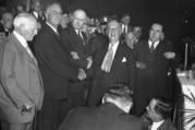 After a fierce battle for the presidential nomination in June 1932, Al Smith shakes hands with Gov. Franklin D. Roosevelt at the state Democratic convention in Albany, N.Y., Oct. 4, 1932. (AP photo)