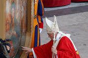 Pope Francis touches a Marian icon as he leaves at the end of a vigil, ahead of Pentecost Sunday, at the Vatican June 8, 2019. (CNS photo/Remo Casilli, Reuters)