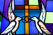 Doves and interlocking wedding bands symbolizing the sacrament of marriage are depicted in a stained-glass window at Sts. Cyril & Methodius Church in Deer Park, N.Y. 