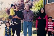 Rich McKinless with Rahim and Rayhanna Ibrahimi, and their three children, Layma, Hamza and Hasib