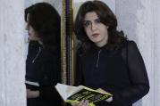 PR agent Francesca Chaouqui holds her book 'In the Name of Peter' (Nel Nome di Pietro), a behind-the-scenes drama of a papal reform commission, on Monday, Feb. 6, 2017. (AP Photo/Andrew Medichini)