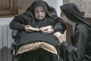 Sister Maria Giuseppina (left) and Sister Maria Caterina (right) are among 10 remaining nuns in a convent on the island of Sardinia who are breaking their silence and embracing the internet in an effort to ensure their order’s survival. This photo is from an exhibition being held at the Santa Chiara convent in Sardinia. Photo courtesy of Gabriele Calvisi.