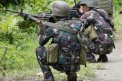 Government troops take positions as fighting with Muslim militants in Marawi city enters its second week on Tuesday, May 30, 2017, in southern Philippines. (AP Photo/Bullit Marquez)