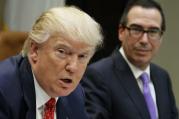 Treasury Secretary Steven Mnuchin listens at right as President Donald Trump speaks during a meeting on the Federal budget, Wednesday, Feb. 22, 2017, in the Roosevelt Room of the White House in Washington. (AP Photo/Evan Vucci)