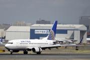 In this Sept. 8, 2015, file photo, a United Airlines passenger plane lands at Newark Liberty International Airport in Newark, N.J. Twitter users are poking fun at United's tactics in having a man removed from an overbooked Chicago to Louisville flight on April 9, 2017. (AP Photo/Mel Evans, File)
