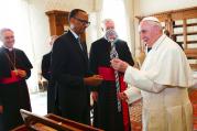 Pope Francis, right, and Rwanda's President Paul Kagame exchange gifts during a private audience at the Vatican, on March 20, 2017. (Tony Gentile/Pool photo via AP)