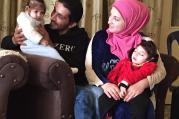 Abdul Ghaleb Edris with his 1-year-old daughter, Fatima, and his wife Souzan and their 2-year-old son, Ayham. The Syrian refugee family arrived in Rome on May 3 