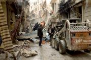 Syrian citizens clear streets in late April after shelling in Aleppo. Chaldean Catholic Bishop Antoine Audo of Aleppo says Christians are losing hope, but not faith, as fighting continues. (CNS photo/Syrian Arab News Agency handout via Reuters)