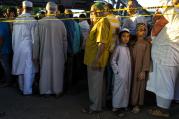 Fear for the Future. People gather for a demonstration on Aug. 13 near a crime scene after the leader of a Queens mosque and an associate were fatally shot as they left afternoon prayers. (AP Photo/Craig Ruttle)
