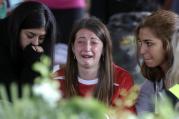 A woman cries ahead of a state funeral for some of the victims of last Wednesday's earthquake, in Amatrice, central Italy, Aug. 30. (AP Photo/Andrew Medichini)