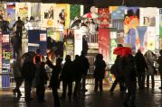 People walk next to colorful giant domino pieces placed along a stretch of the original path of the Berlin Wall Nov. 9, the 20th anniversary of the wall's demise. (CNS photo/Maya Hitij, Reuters) 