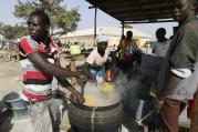 People fleeing Boko Haram violence in the northeast region of Nigeria cook food at a camp for internally displaced people in Yola Jan. 13. (CNS photo/Afolabi Sotunde, Reuters)