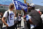 Healthy Dialogue? Zack W., left, listens to Maurice Hardwick at a protest while Republican presidential candidate Donald Trump delivered an economic policy speech to the Detroit Economic Club in Detroit, Monday, Aug. 8, 2016. (AP Photo/Paul Sancya)