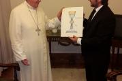 Adrian Pallarols shows Pope Francis the design for the chalice.