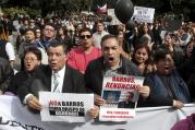 Chileans protest Bishop Juan Barros in Osorno, Chile, March 21, as the newly appointed bishop celebrates his first Mass there. 