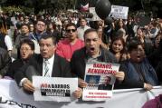 Chileans protest Bishop Juan Barros in Osorno, Chile, March 21, as the newly appointed bishop celebrates his first Mass there. 