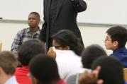 Jesuit Father James Van Dyke, principal of Cristo Rey Atlanta Jesuit High School, addresses students during an orientation, August 2014.
