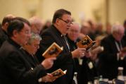 Cardinal-designate Joseph W. Tobin of Indianapolis, center, joins other bishops during morning prayer Nov. 15 at the annual fall general assembly of the U.S. Conference of Catholic Bishops in Baltimore (CNS photo/Bob Roller). 