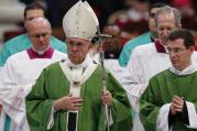 Pope Francis leaves after celebrating the closing Mass of the Synod of Bishops on the family in St. Peter's Basilica at the Vatican, Oct. 25 (CNS photo/Paul Haring).