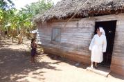 Sister Olga Arias visits a family of nine, including seven children, in early March in rural Cuba. It can be daunting to transmit the values of the church when families are focused on day-by-day survival, she said. (CNS photo/Rhina Guidos)