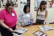 Members of a U.S. delegation interested in learning about the Salvadoran martyrs look at pictures in the Archbishop Romero Center at Central American University in San Salvador July 24. 