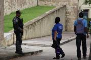 An armed Honduran soldier stands outside the U.S. Embassy in Tegucigalpa on Sept. 12.