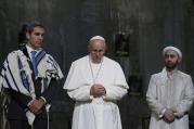 Pope Francis stands between Jewish and Muslim religious leaders during a prayer service at the ground zero 9/11 Memorial Museum in New York, Sept. 25 (CNS Photo / Paul Haring)..
