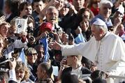 Pope Francis greets the crowd as he arrives to lead his general audience in St. Peter's Square at the Vatican Nov. 6. (CNS photo/Paul Haring) (Nov. 6, 2013) See POPE-AUDIENCE Nov. 6, 2013.