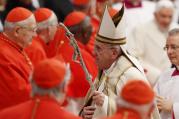 Pope Francis leaves after a consistory at which he created 20 new cardinals in St. Peter's Basilica at the Vatican Feb. 14. Retired Pope Benedict XVI, pictured at right in the background, attended the ceremony. (CNS photo/Paul Haring)