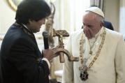 Bolivian President Evo Morales presents a gift to Pope Francis at the government palace in La Paz, Bolivia, July 8. The gift was a wooden hammer and sickle -- the symbol of communism -- with a figure of a crucified Christ. (CNS photo/L'Osservatore Romano)