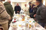 Pope saying grace with 8 homeless people on his 80th birthday. (L'Osservatore Romano)