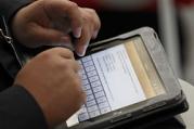 A participant uses an Apple iPad during the Catholic Press Congress at the Vatican Oct. 4. (CNS photo/Paul Haring) (Oct. 4, 2010) See PRESS-MISSION Oct. 4, 2010.