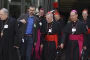 Cardinal Kasper and other prelates leave morning session of extraordinary Synod of Bishops on the family at the Vatican, Oct. 7.