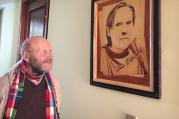 Jesuit Father Xavier Albo stands next to picture of slain Jesuit Father Luis Espinal in La Paz, Bolivia, July 3. On July 8, Pope Francis is expected to pray near the site where Father Espinal's remains were found in 1980. (CNS photo/David Agren) 