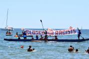 People join a demonstration titled, "City Flotilla, at Sea Against Racism," to protest against the scheduled arrival of the C Star, a ship that an anti-immigrant group has chartered to try and halt migrant arrivals to Europe from Africa and elsewhere, in Catania, Sicily Island, Italy, on July 29. (Orietta Scardino/ANSA via AP)