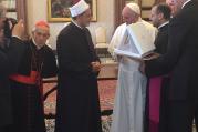 Pope Francis gives the sheik of Al-Azhar medallion of the Olive of Peace. 
