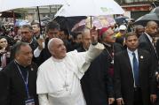 Pope Francis waves to residents in Varginha slum in Rio de Janeiro, July 25 (CNS/Paul Haring)