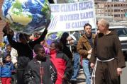 Sam Fuller, OFM Cap., leading a march on climate change in Hartford, Ct. (Photo via Wikimedia Commons)