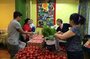 The weekly food basket distribution at Romero House