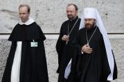 Metropolitan Hilarion of Volokolamsk, head of ecumenical relations for the Russian Orthodox Church, right, arrives for the morning session of the extraordinary Synod of Bishops on the family at the Vatican Oct. 16. (CNS photo/Paul Haring)