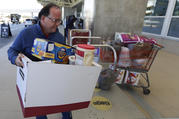 A food and supply donation for unpaid but working Transportation Safety Administration agents lands at Orlando International Airport on Jan. 16. (AP Photo/John Raoux)