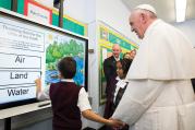 TASKMASTER. Pope Francis gets a lesson on the environment in East Harlem.