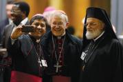 Selfie Reflection. An unidentified bishop with German Cardinal Walter Kasper and Melkite Catholic Patriarch Gregoire III Laham strike a pose after the synod’s final session on Oct. 24. 