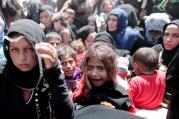 A young Syrian refugee girl cries after arriving at the Turkish-border city of Sanliurfa in June.