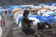 A Syrian refugee near the Turkish border